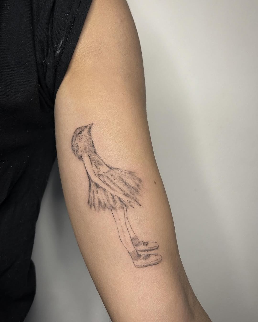 Whimsical bird dancer tattoo adds ethereal charm Tattoo Design