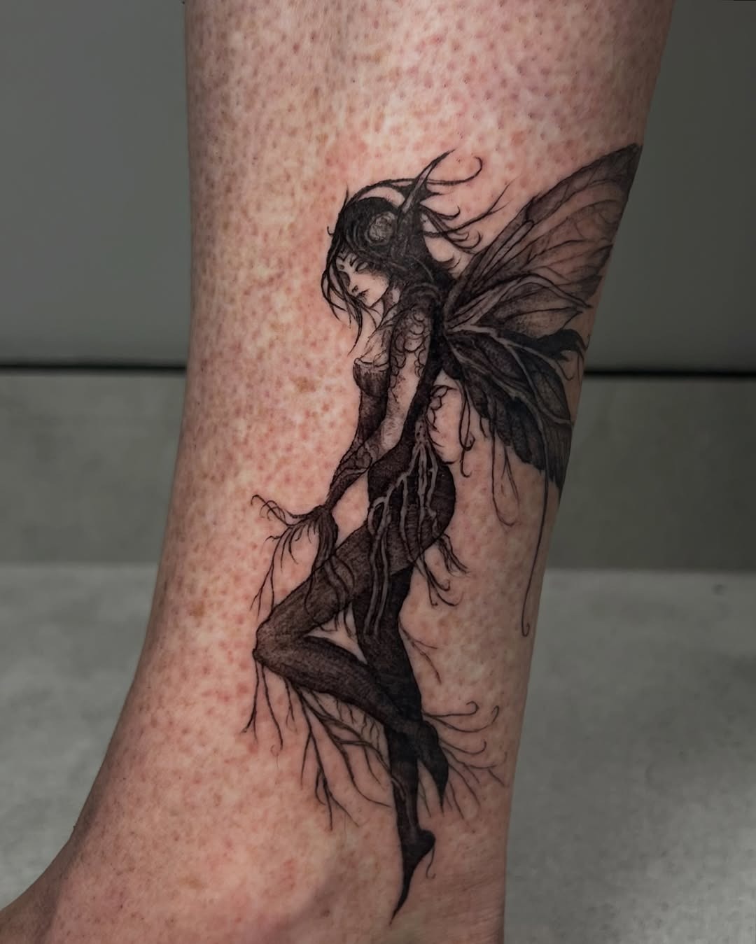 Whimsical fairy tattoo with striking details Tattoo Design