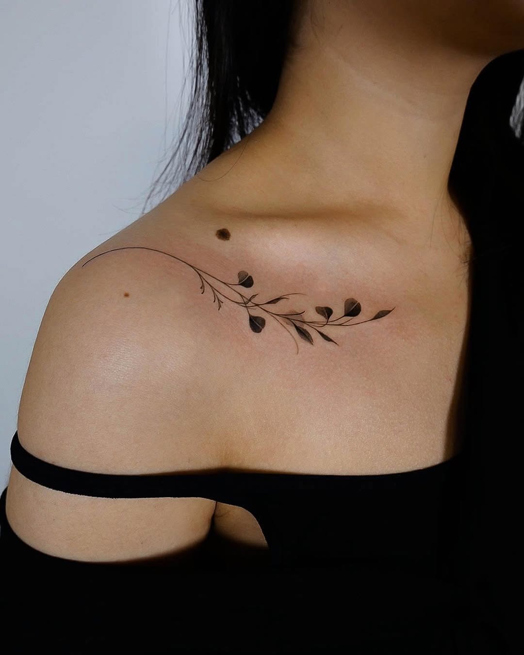 Delicate eucalyptus vine tattoo on shoulder Tattoo Design