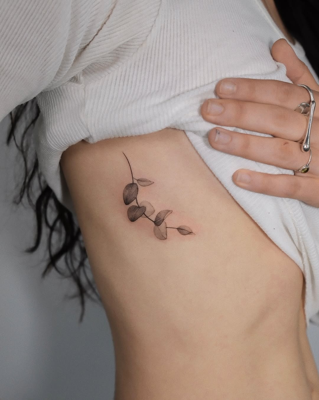 Elegant eucalyptus tattoo on the arm Tattoo Design