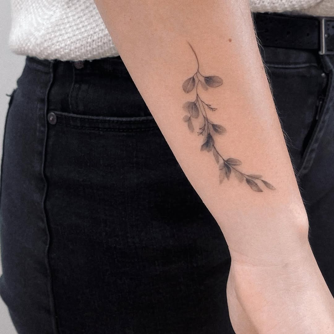 Elegant eucalyptus tattoo on the forearm Tattoo Design