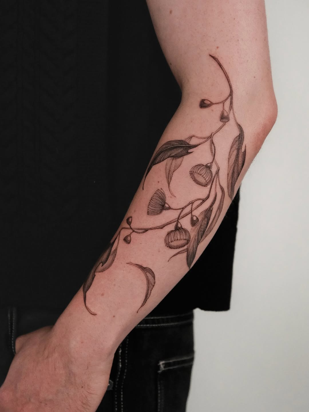 Elegant eucalyptus tattoo showcases nature's beauty Tattoo Design