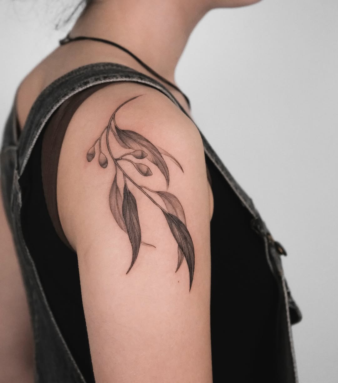 Elegant eucalyptus tattoo with intricate line work Tattoo Design