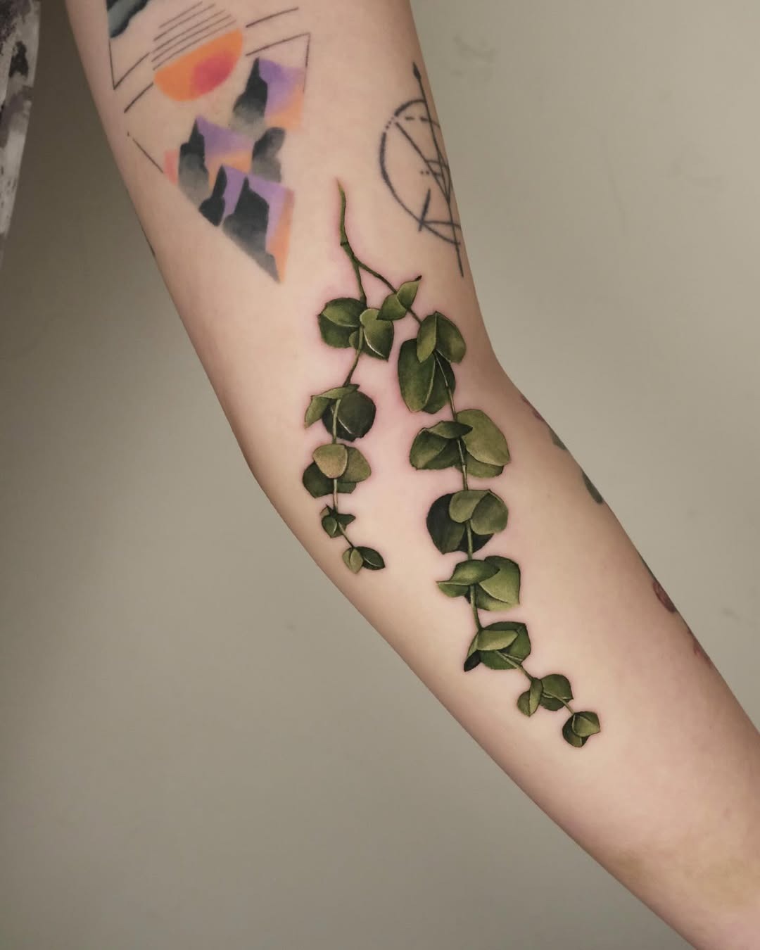 Elegant eucalyptus vine tattoo on the forearm Tattoo Design