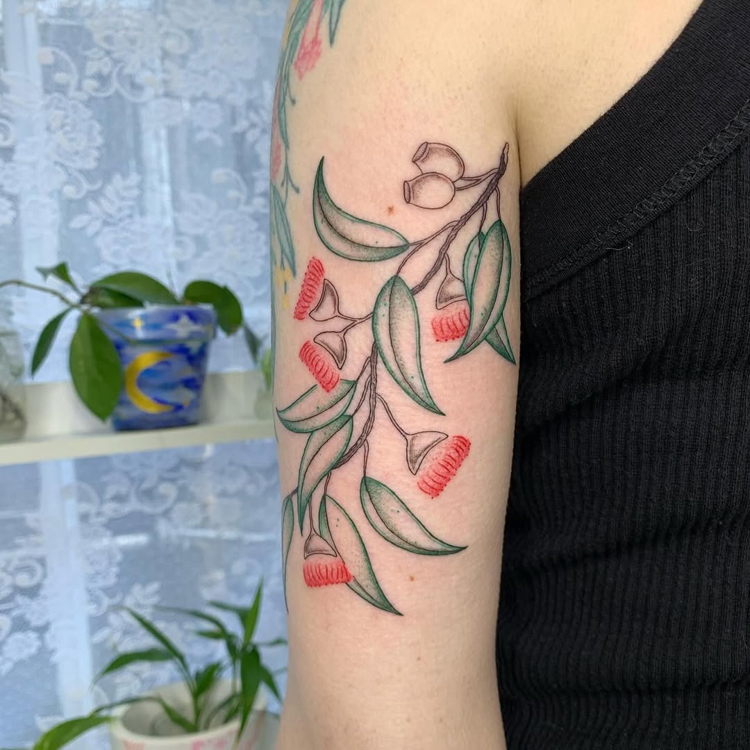 Stunning eucalyptus tattoo with vibrant blossoms Tattoo Design