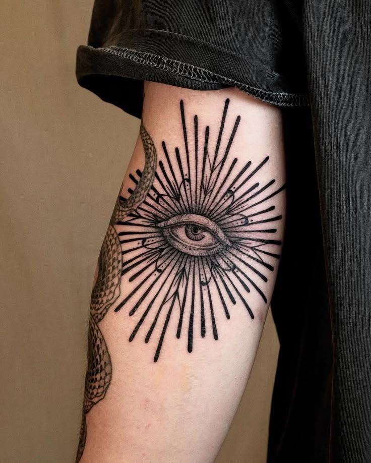 Bold Radiant Eye for the Upper Arm Tattoo Design