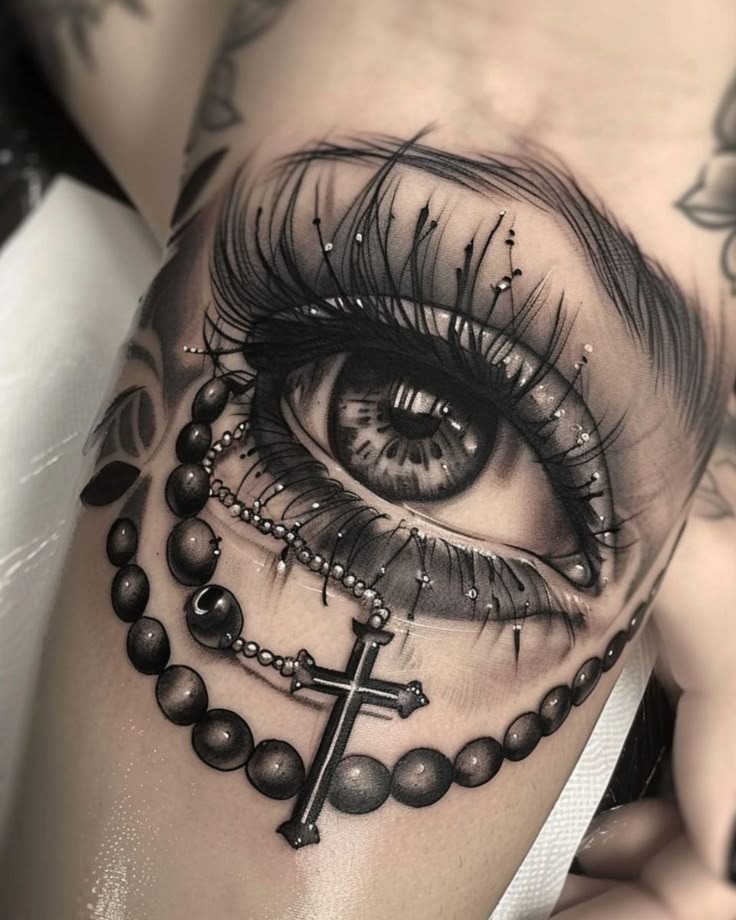 Dramatic Realistic Evil Eye With Rosary Details Tattoo Design