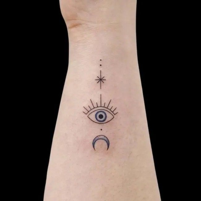 Minimal Evil Eye With Moon and Star Tattoo Design