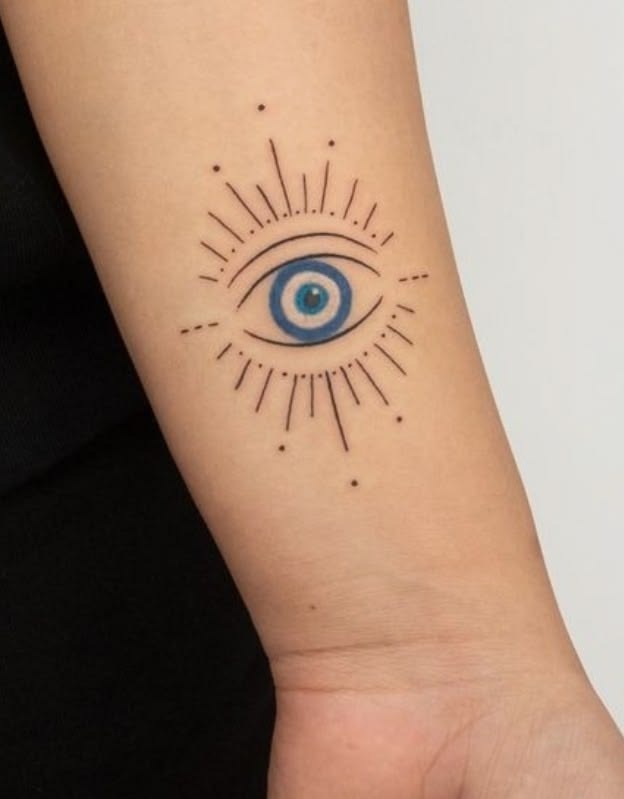 Simple Blue Evil Eye With Fine Radiating Lines Tattoo Design