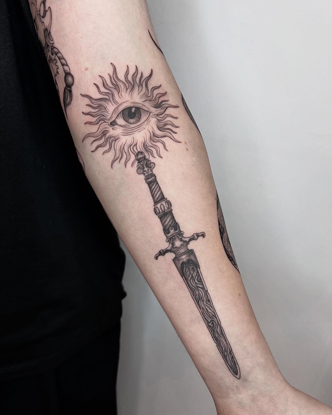 A unique eye and sword tattoo design Tattoo Design
