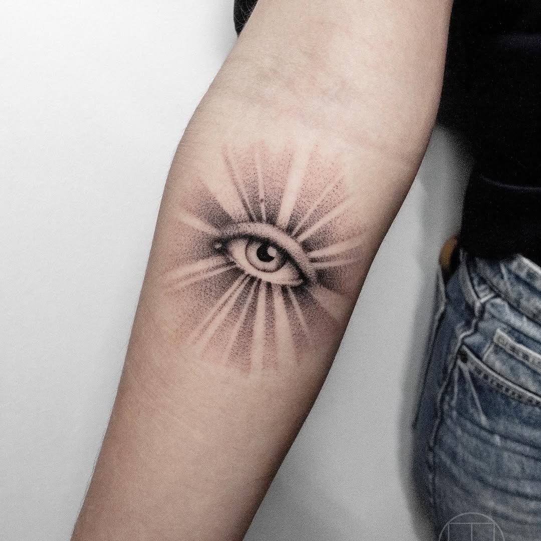 Intricate Eye Tattoo with Radiating Lines Tattoo Design