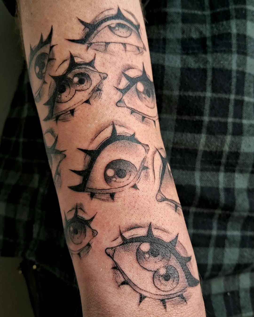 Intricate spiky eye tattoos on display Tattoo Design