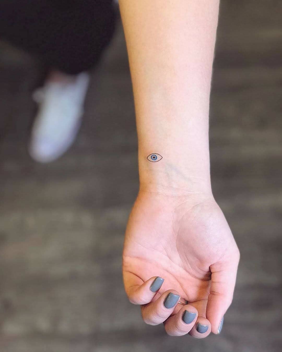 Minimalist eye tattoo design on the forearm Tattoo Design
