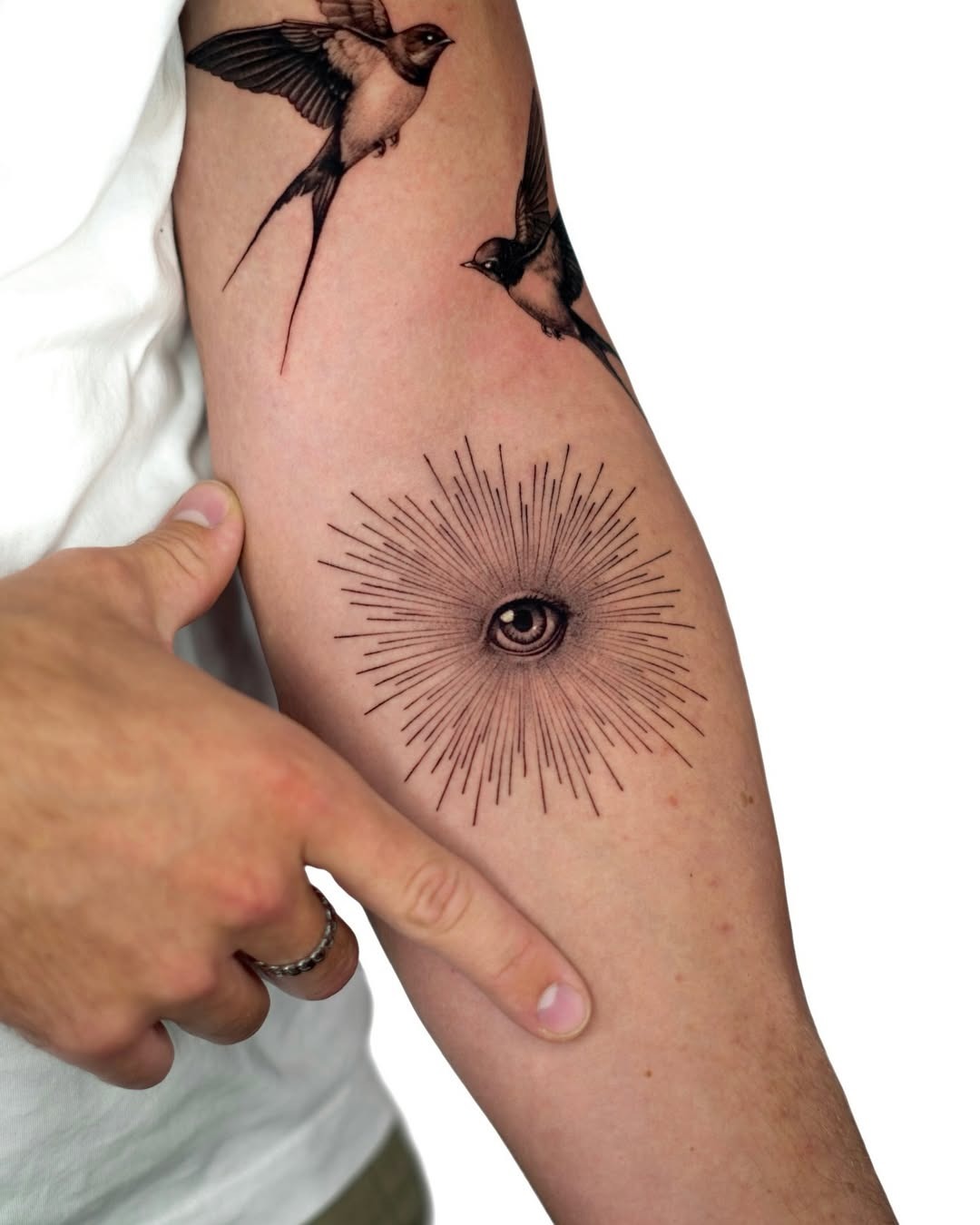 Striking eye tattoo radiating artistic energy Tattoo Design