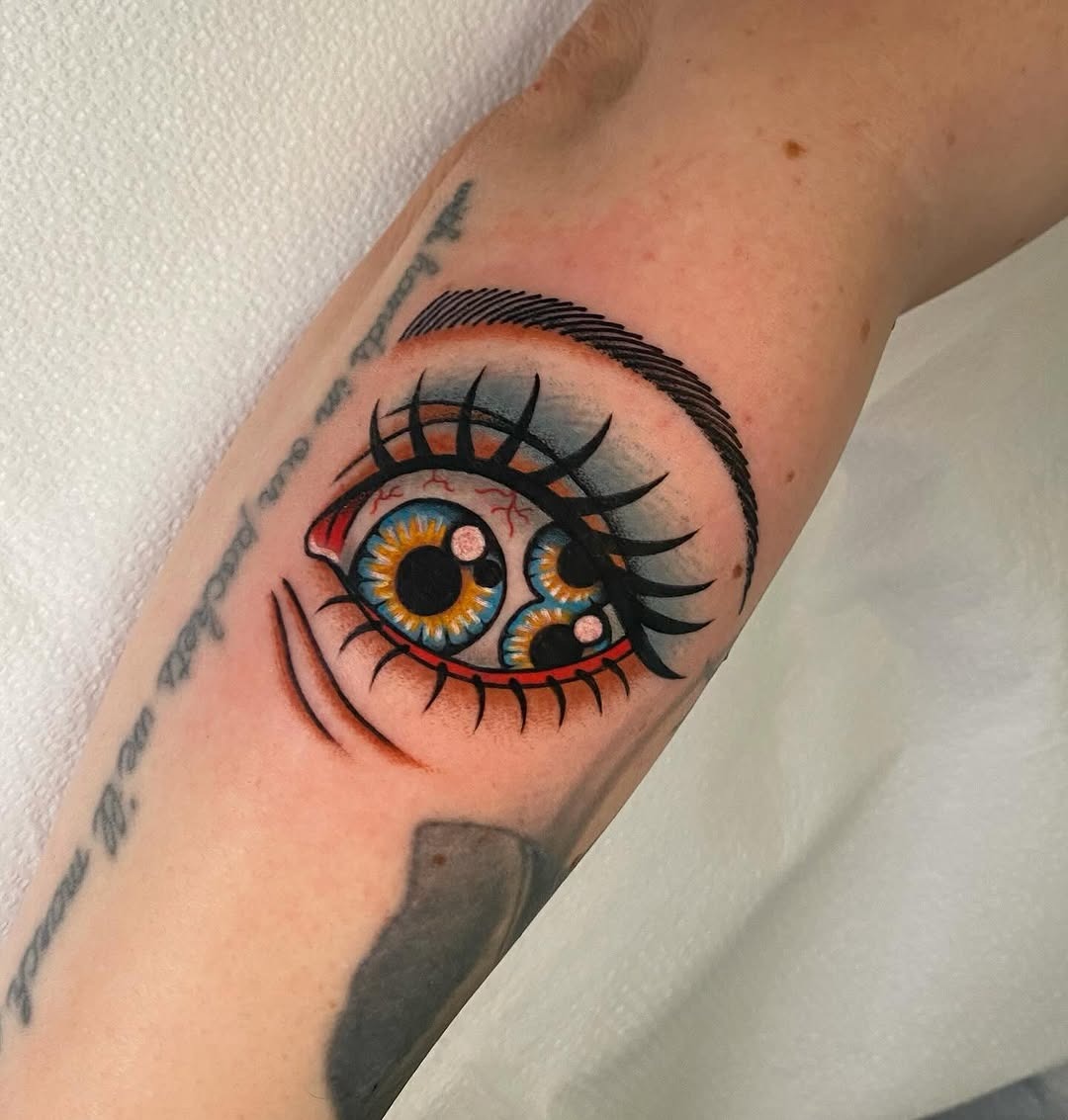 Stunning Vibrant Eye Tattoo with Unique Detail Tattoo Design