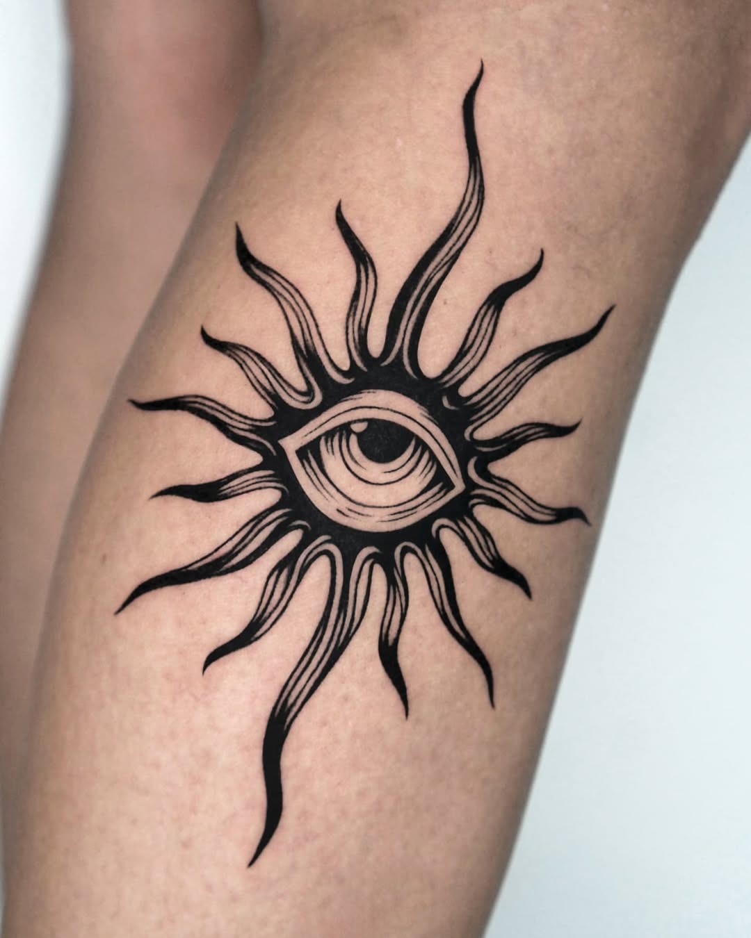 Stylish eye tattoo with sunburst elements Tattoo Design
