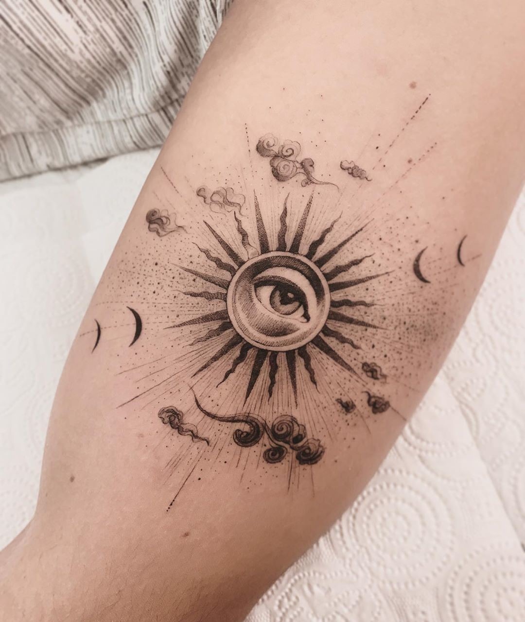 Symbolic Eye Tattoo with Celestial Elements Tattoo Design