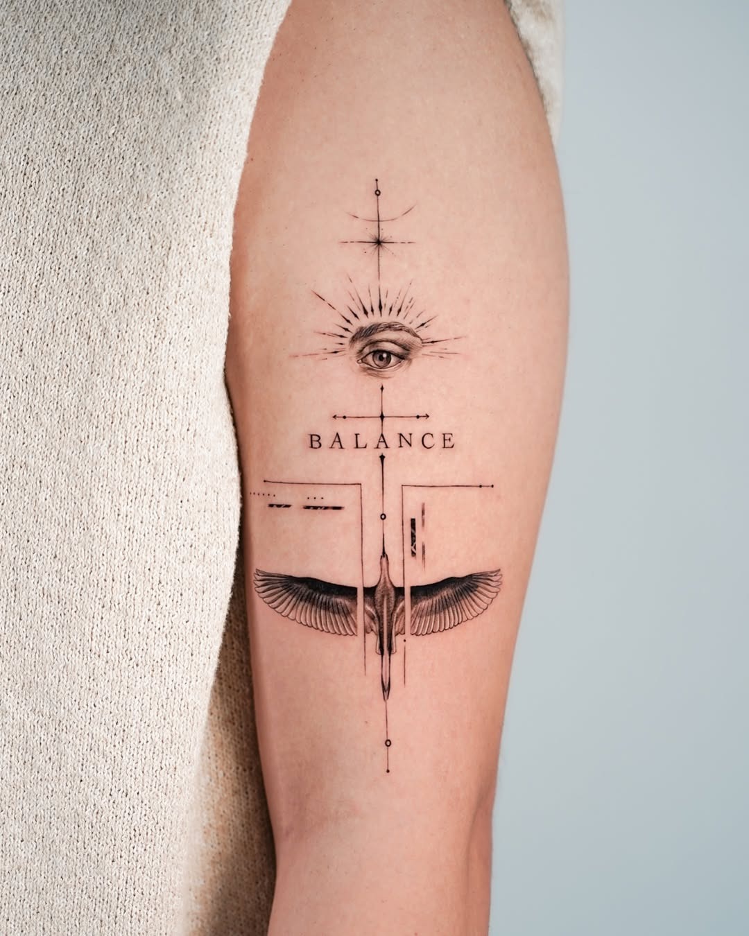 Symbolic tattoo combining balance and vision elements Tattoo Design