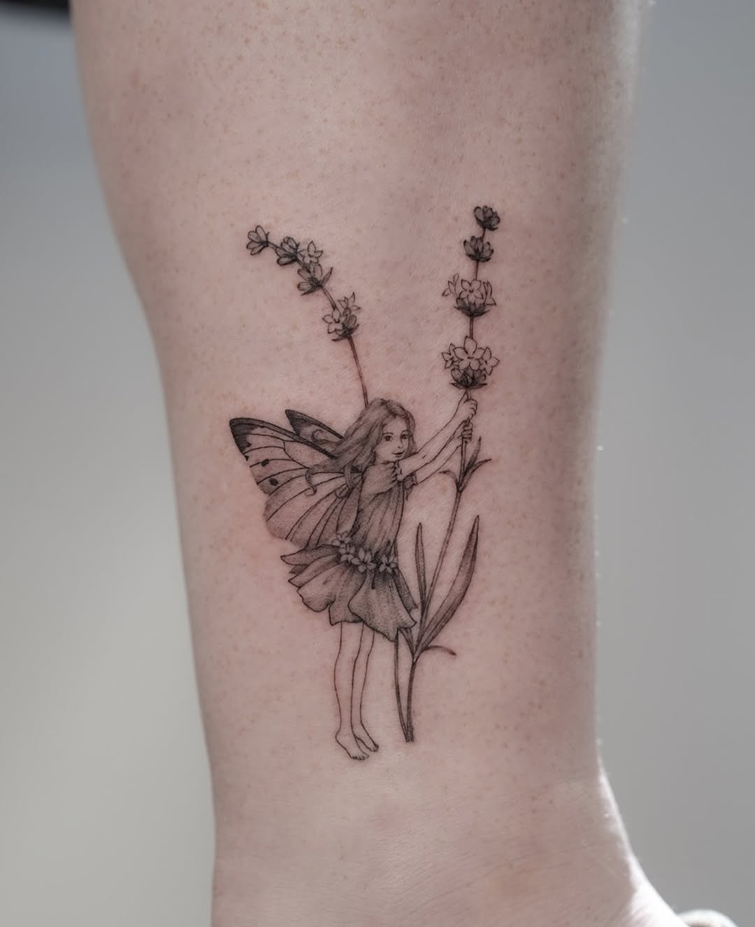 Delicate fairy surrounded by lavender flowers Tattoo Design