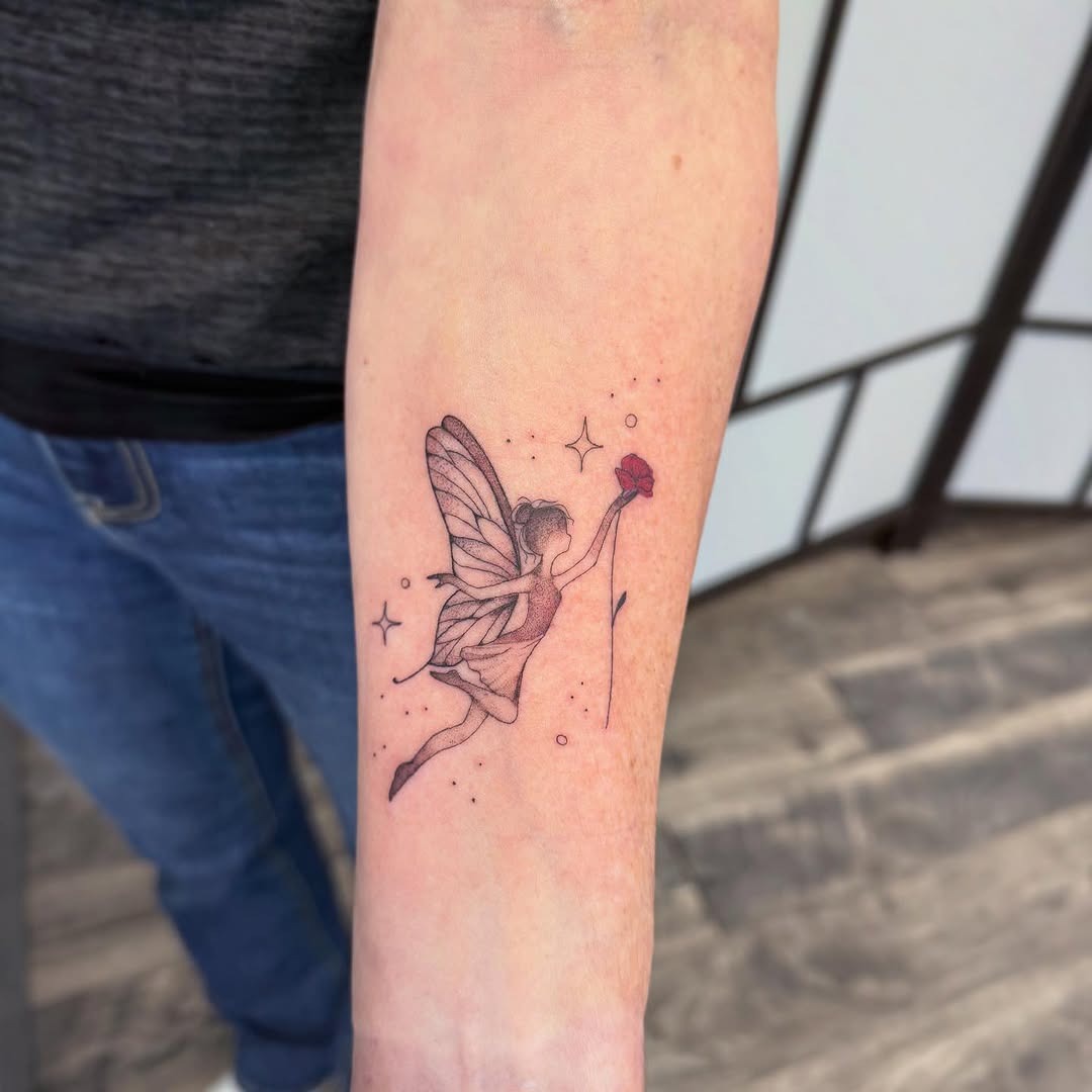 Delicate fairy tattoo reaching for a flower Tattoo Design