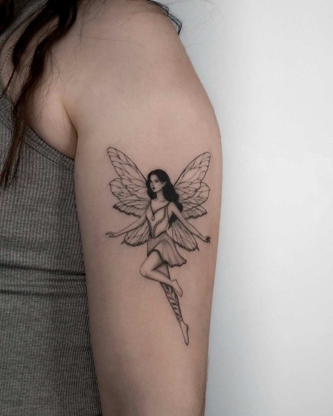Elegant fairy tattoo with graceful wings Tattoo Design