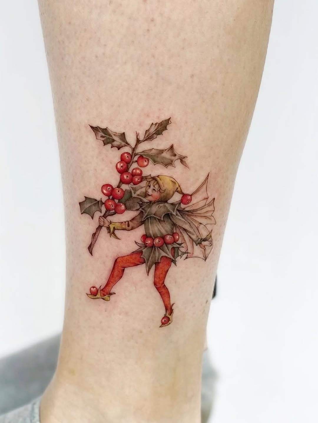Enchanting fairy celebrating winter’s charm Tattoo Design
