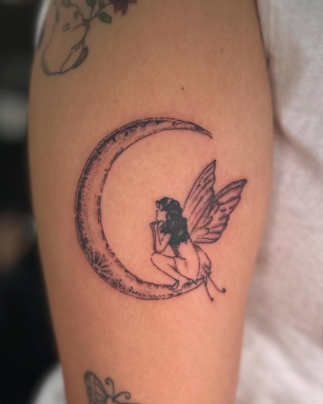 Enchanting fairy resting on a crescent moon Tattoo Design