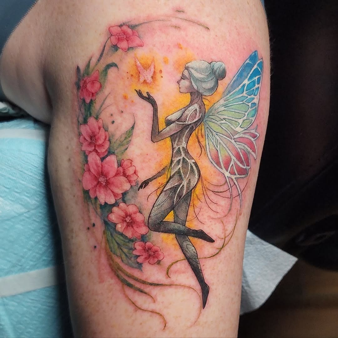 Enchanting fairy tattoo amidst blooming flowers Tattoo Design