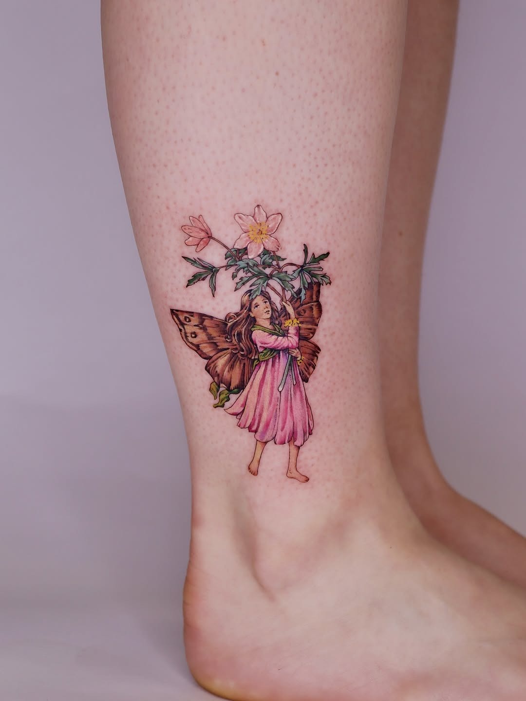 Whimsical fairy tattoo with butterfly and flowers Tattoo Design