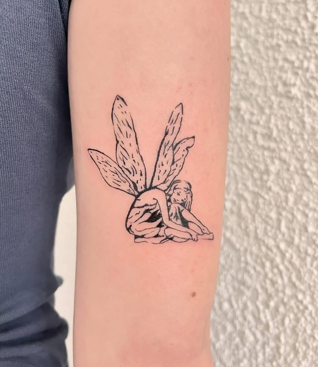 Whimsical fairy tattoo with delicate wings Tattoo Design