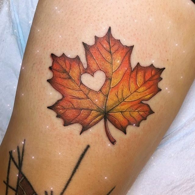 Autumn Leaf with Heart Cutout Tattoo Design