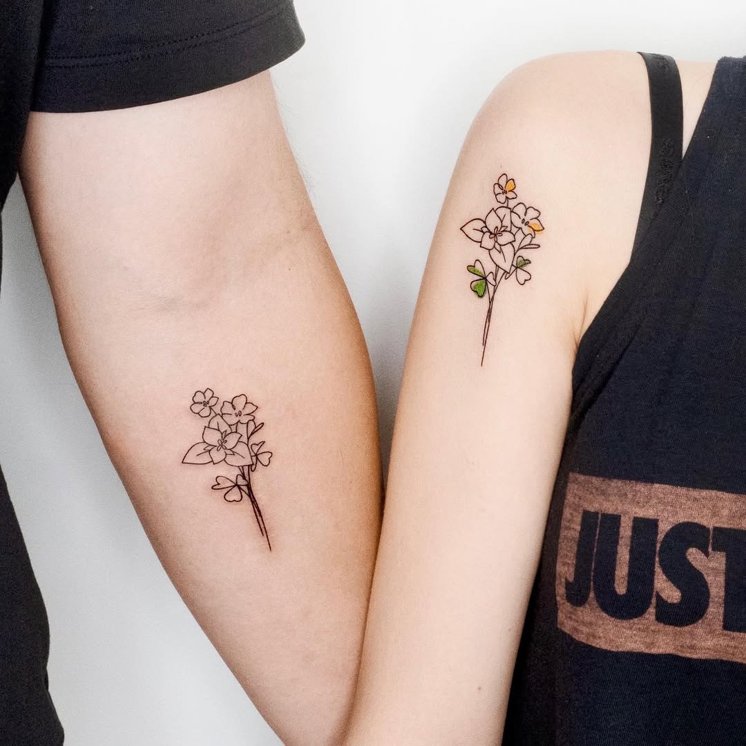 Beautiful complementary flower tattoos for father and daughter Tattoo Design