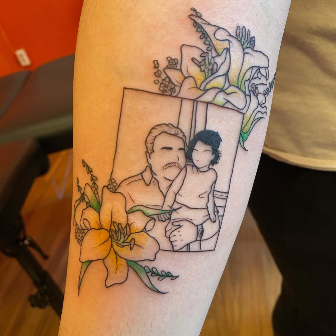 Heartfelt father-daughter portrait tattoo with flowers Tattoo Design
