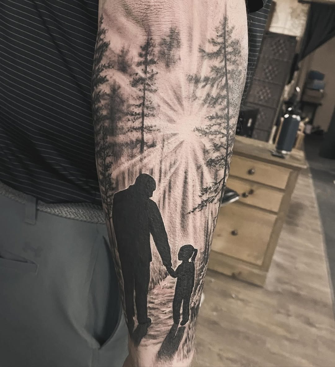 Heartwarming father-daughter silhouette tattoo design Tattoo Design