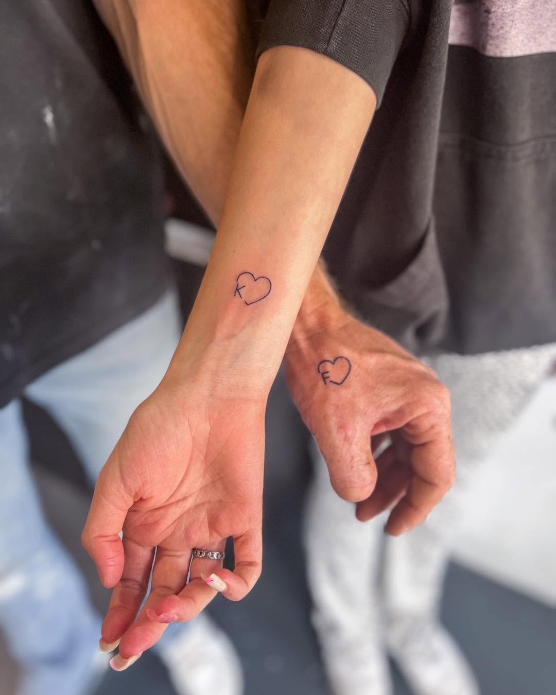 Minimalist heart tattoos symbolize father-daughter bond Tattoo Design
