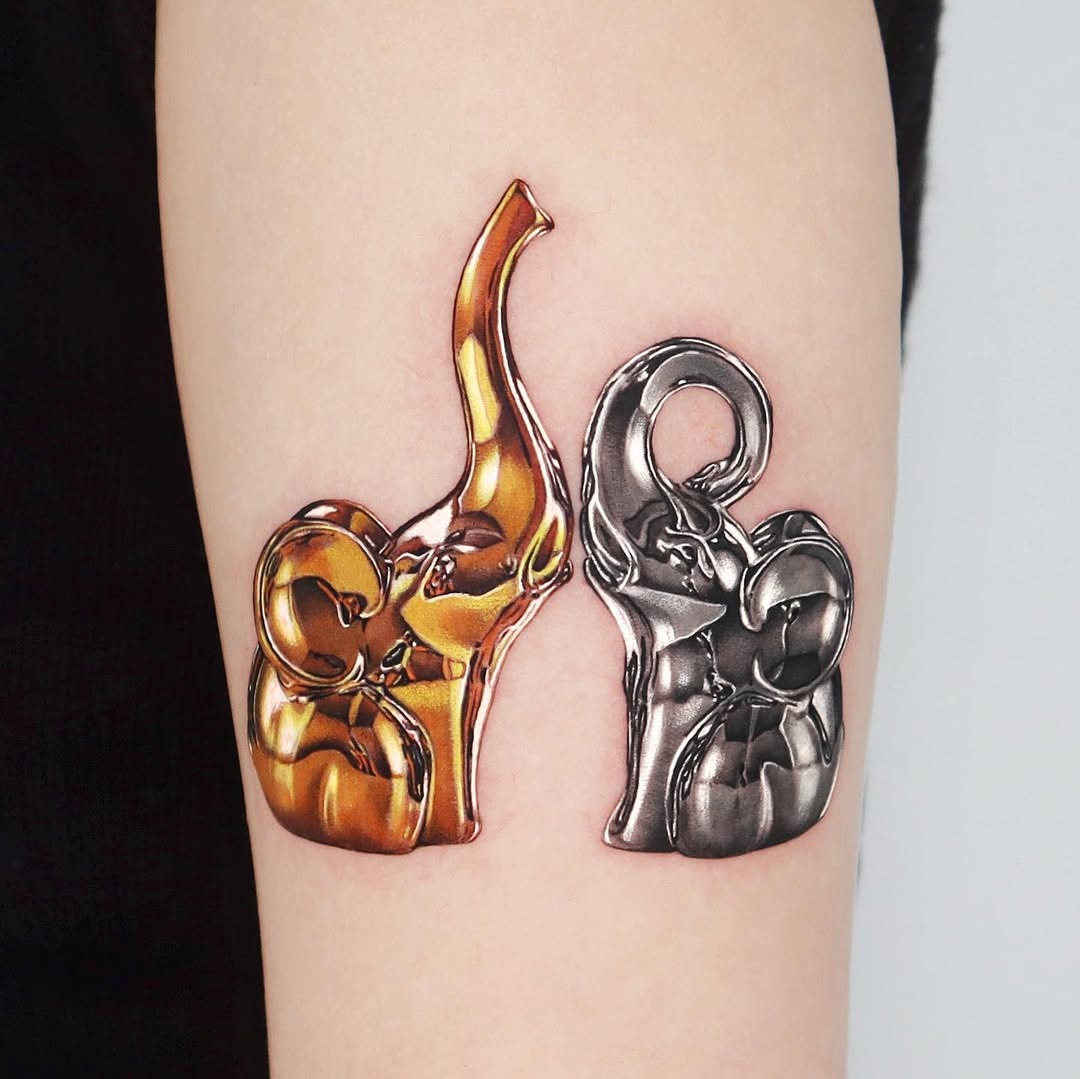 Stylish father-daughter elephant tattoo duo Tattoo Design