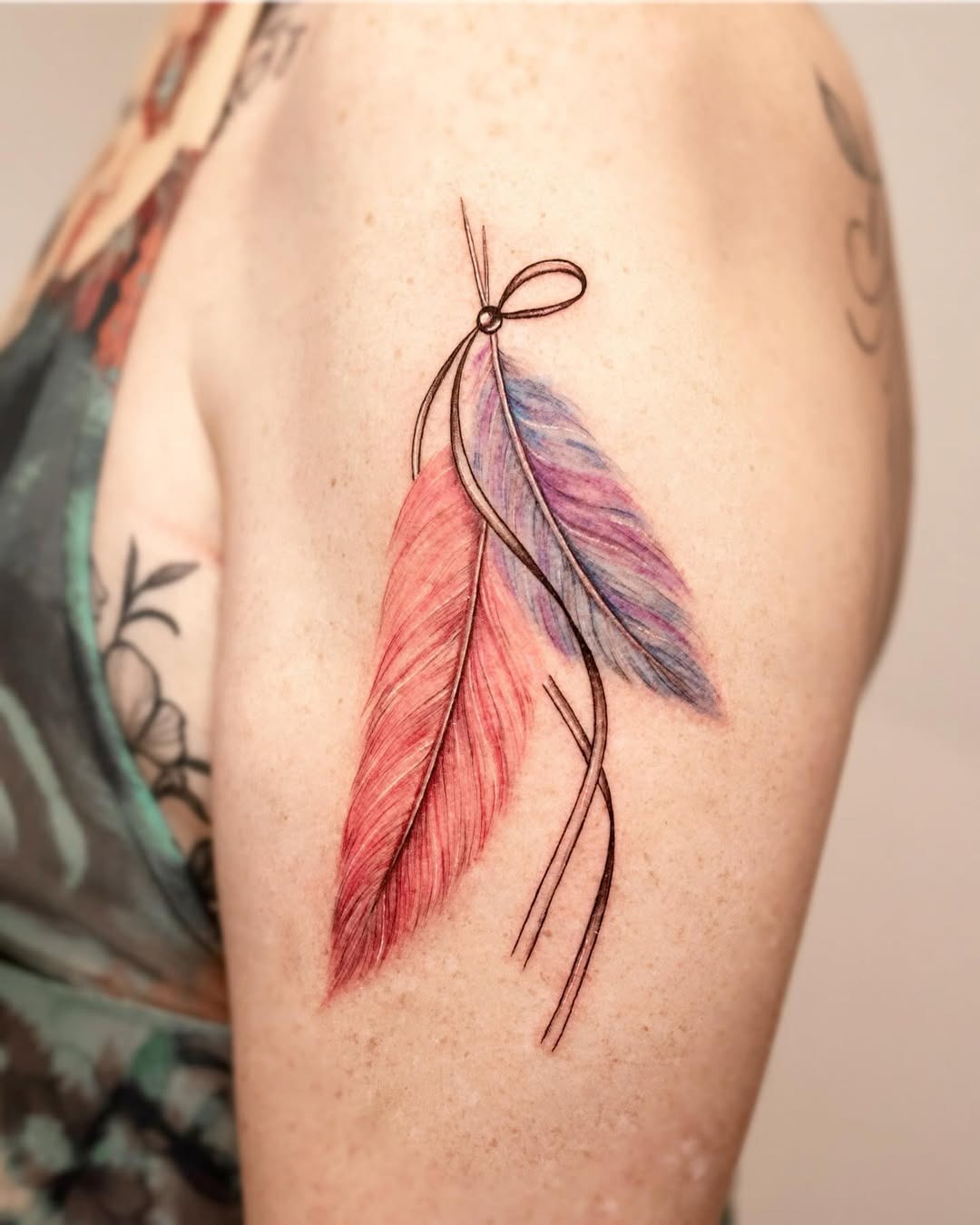 Colorful feather tattoo with elegant details Tattoo Design