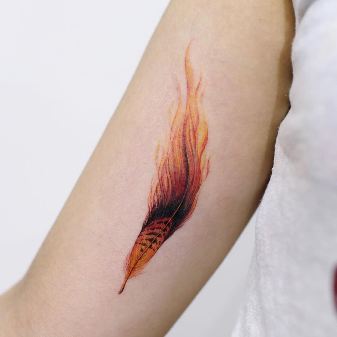 Dynamic feather tattoo with fiery gradients Tattoo Design