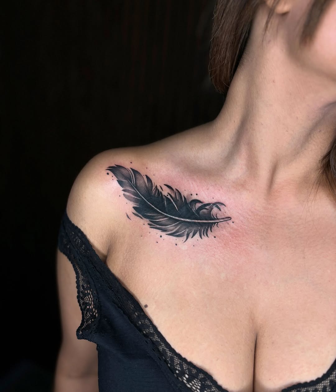 Elegant black feather tattoo on shoulder Tattoo Design