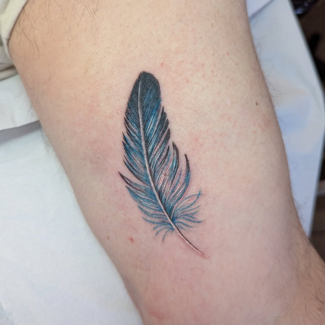 Elegant blue and black feather tattoo design Tattoo Design