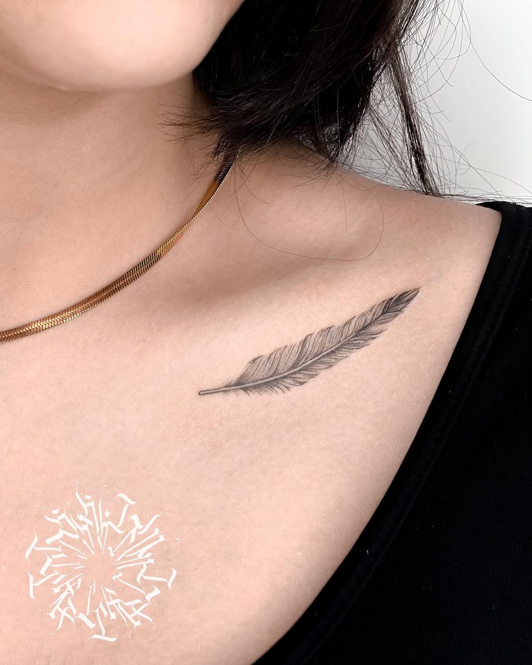 Elegant Feather Tattoo on Delicate Skin Tattoo Design