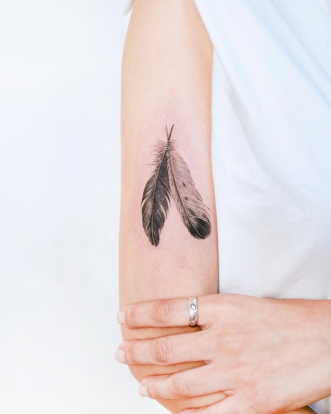 Elegant feather tattoo showcasing intricate details. Tattoo Design