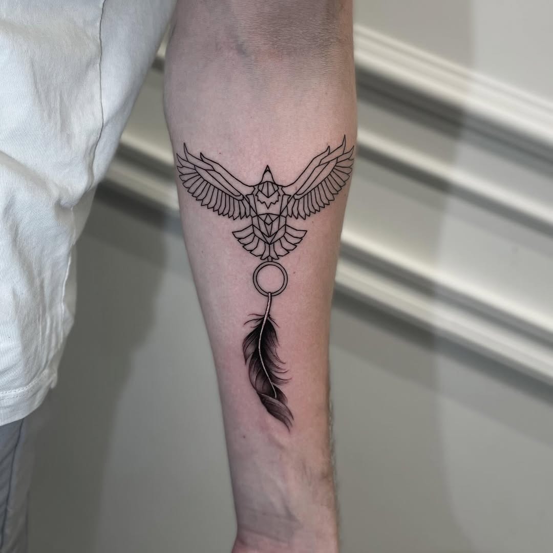 Elegant feather tattoo with bird motif Tattoo Design