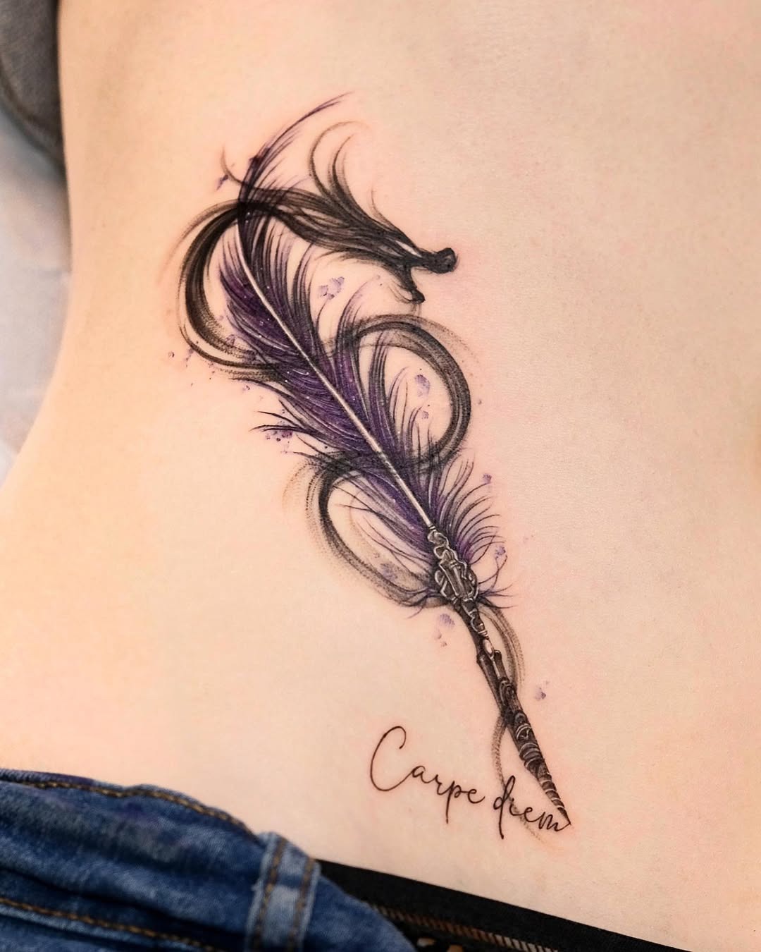 Elegant feather tattoo with inspirational script Tattoo Design
