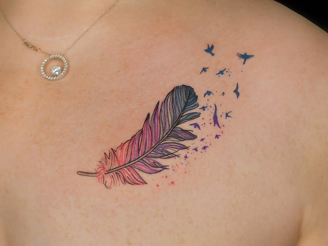 Elegant feather tattoo with playful bird motif Tattoo Design