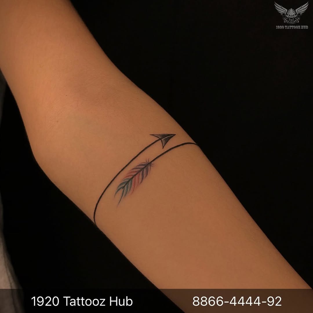 Elegant minimalist feather and arrow tattoo design Tattoo Design