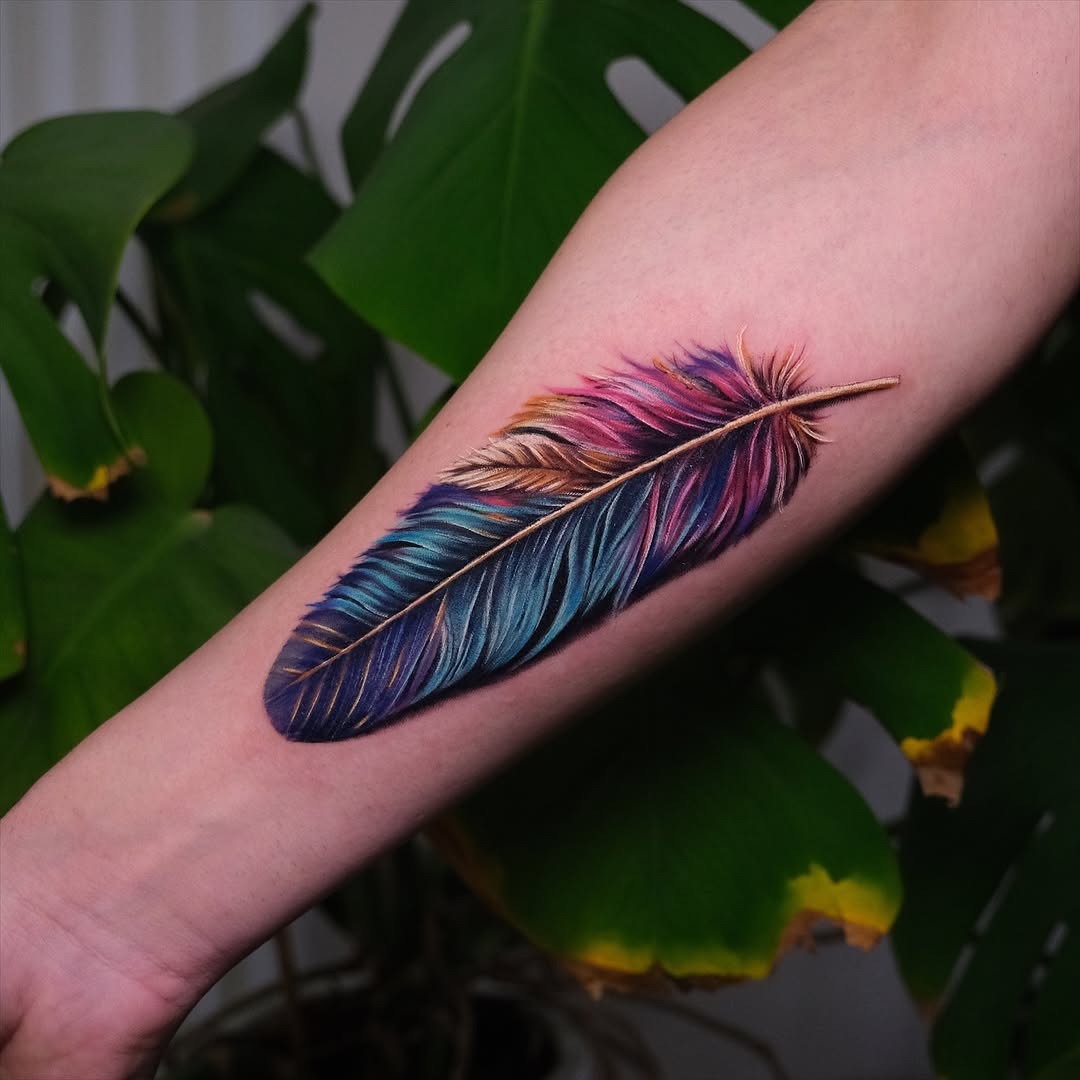 Stunning Colorful Feather Tattoo on Arm Tattoo Design