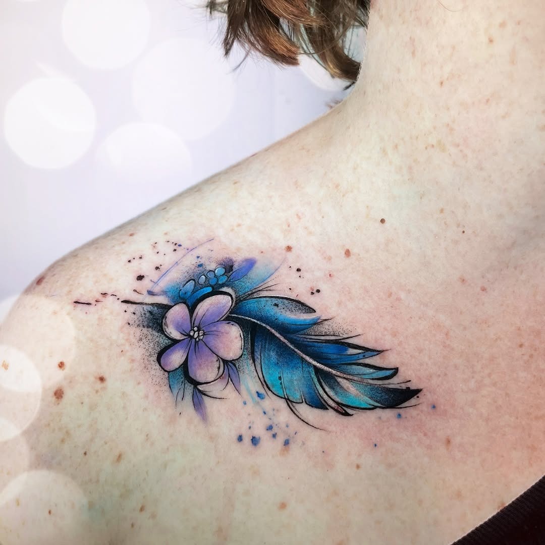 Stunning feather tattoo with floral elements Tattoo Design