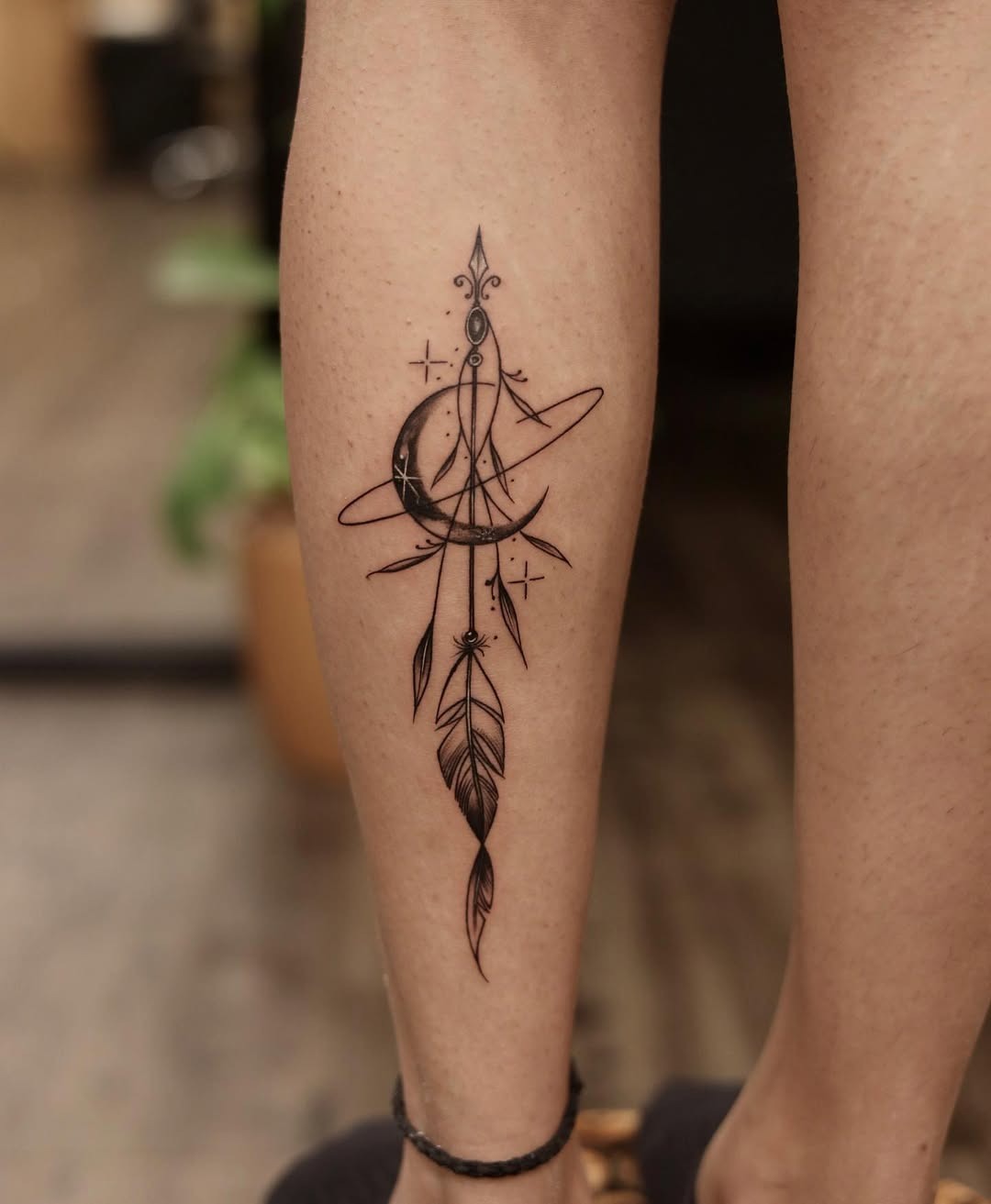 Stylish feather and moon tattoo design Tattoo Design