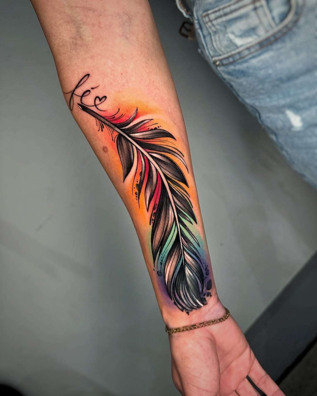 Vibrant feather tattoo with a colorful touch Tattoo Design